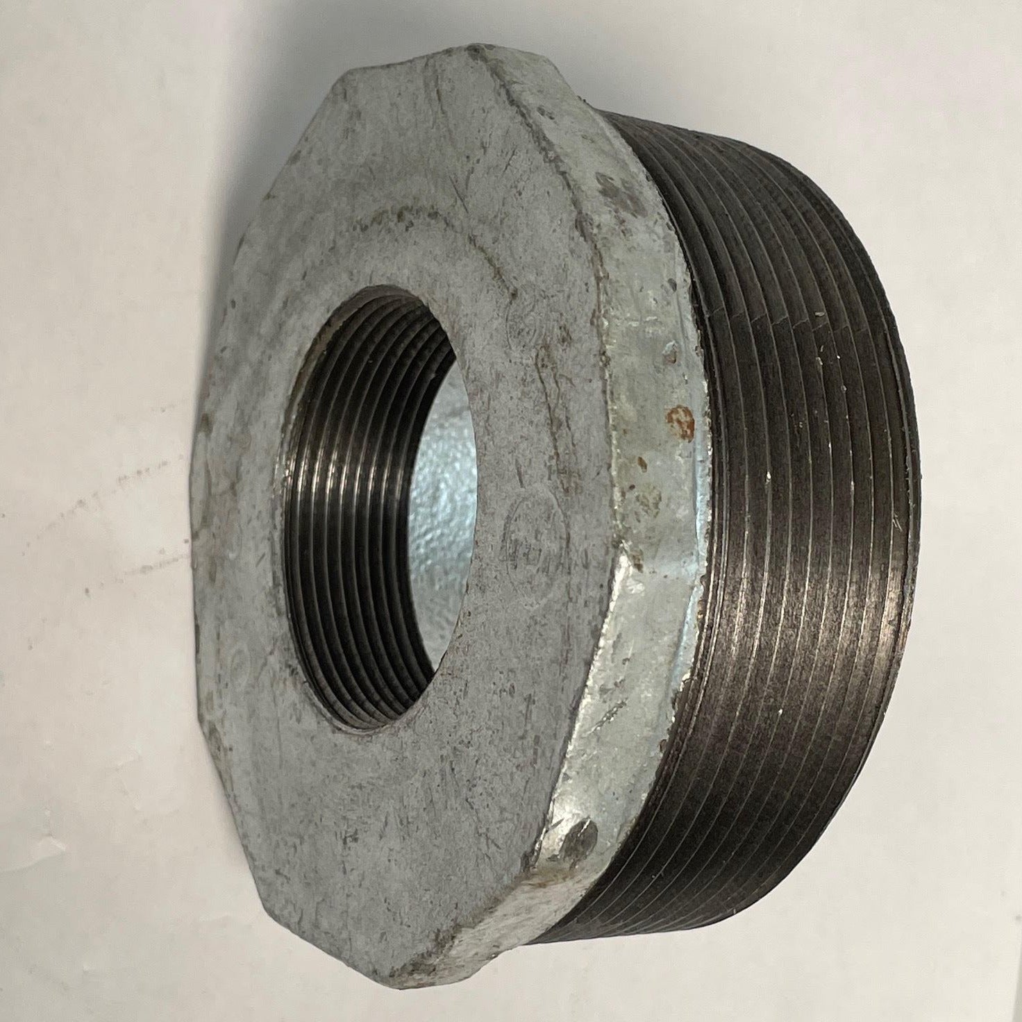 Galvanized Reducing Bushing, 4 Inch x 2 Inch NPT Thread