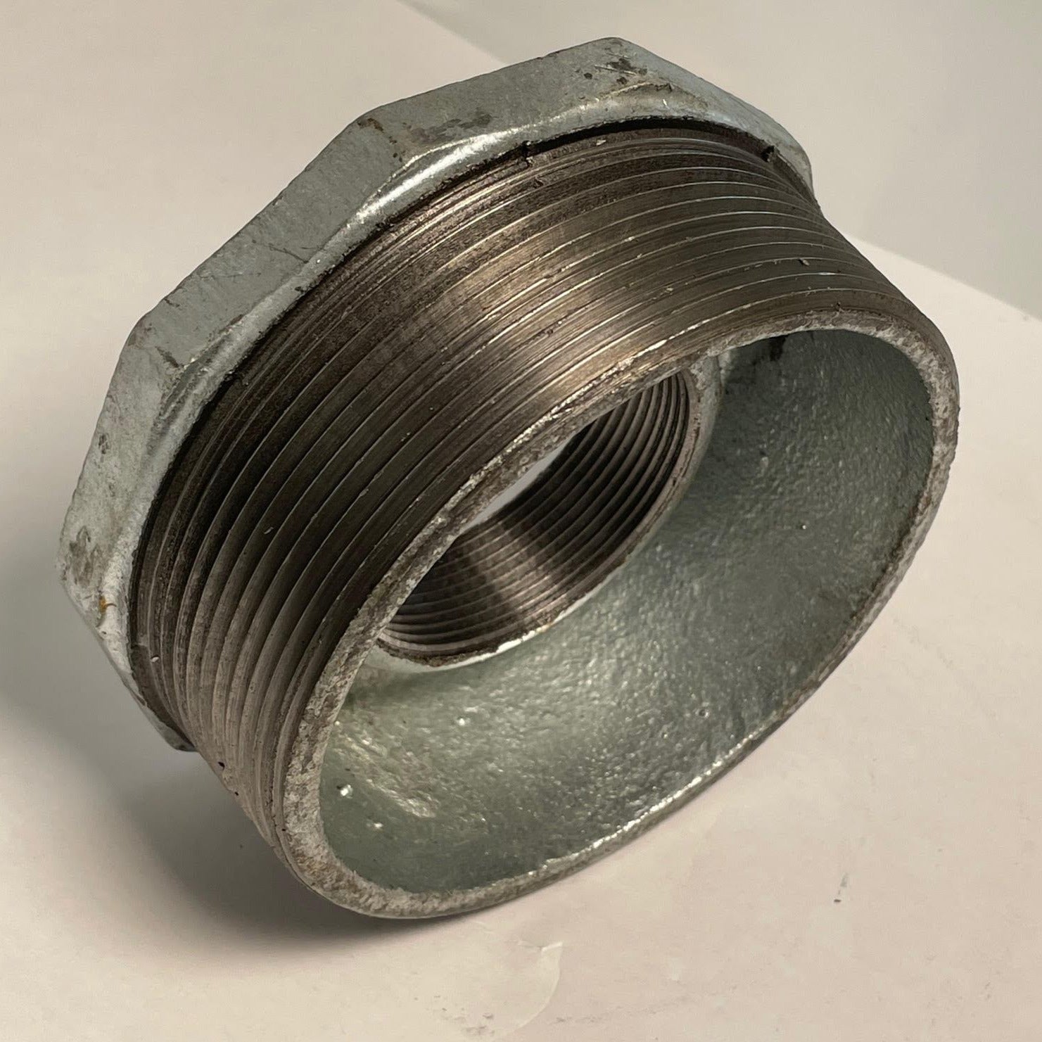 Galvanized Reducing Bushing, 4 Inch x 2 Inch NPT Thread